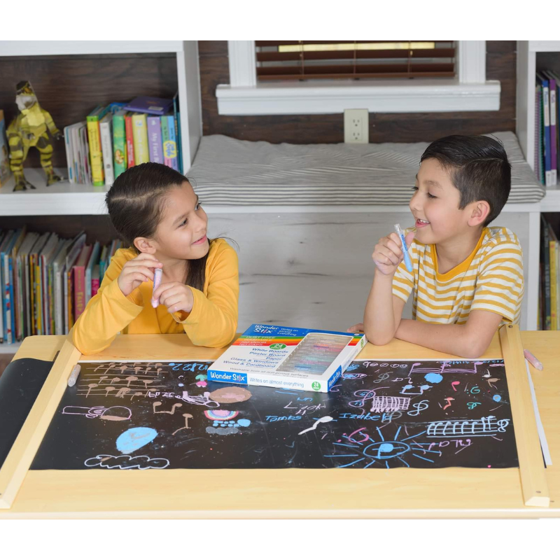 children coloring on wonderstix playmat