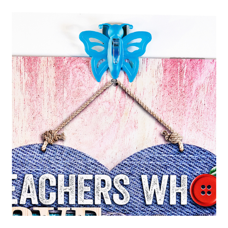 blue butterfly magnet holding up sign