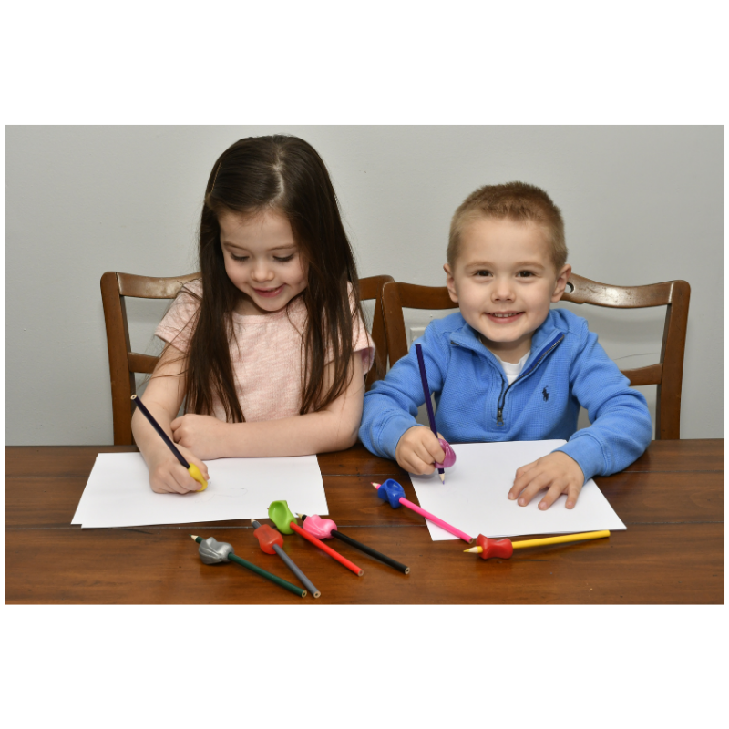 children using pencil grippers for handwriting help